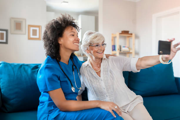 istock Nurse and Elderly Patient Taking a Selfie 1180634450