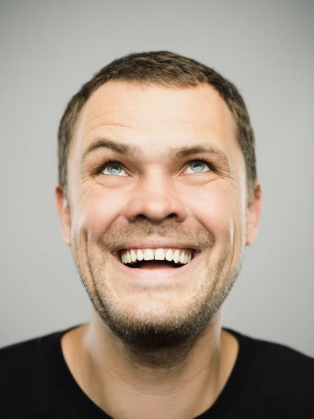 istock Portrait of real caucasian man with excited expression looking up 1180634467