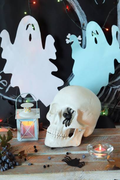istock Skull, mystical decor, illumination, decorative lantern, autumn leaves 1180641752