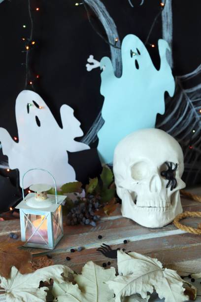 istock Skull, mystical decor, illumination, decorative lantern, autumn leaves 1180641755