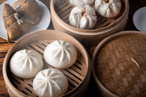 istock chinese steamed bun in traditional bamboo steamer 1180642138