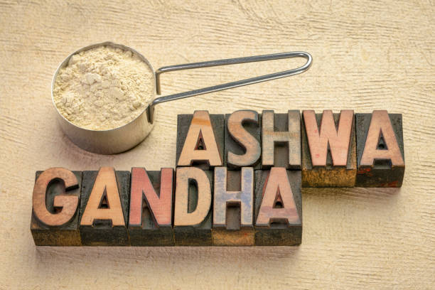 ashwagandha root powder scoop of ashwagandha root (aka Indian ginseng) powder with a text in vintage letterpress wood type, superfood healthy supplement printing block photos stock pictures, royalty-free photos & images