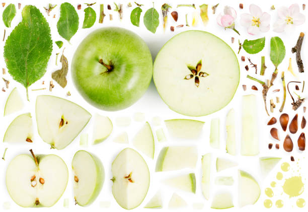 Apple Collection Abstract Large collection of apple fruit pieces, slices and leaves isolated on white background. Top view. Seamless abstract pattern. green apple slice overhead stock pictures, royalty-free photos & images