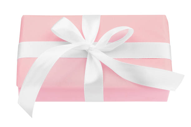 istock Pink gift box with white ribbon and bow isolated on white background 1180645260