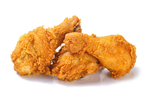 istock Fried crispy spicy chicken legs on white background 1180645516