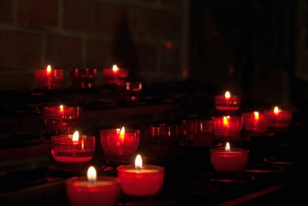 istock memory candles in the church 1180647814