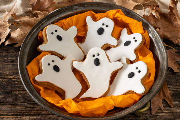 Halloween gingerbread cookies on the wooden table halloween concept with homemade cookies ghost cookie stock pictures, royalty-free photos & images