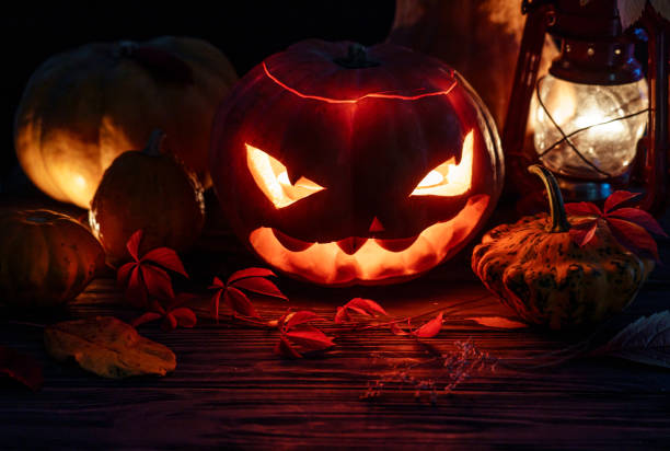 istock Spooky evil scary illuminated halloween pumpkin night horror lantern candle light, happy halloween dark holiday celebration, trick or treat creepy mystery all saints background october eve decoration 1180663576