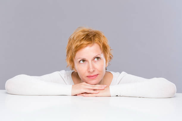 istock Woman with short red hair 1180665097