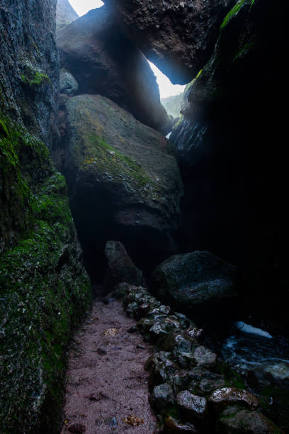 istock Dirt Trail Heads into Dark Tunnel 1180665133