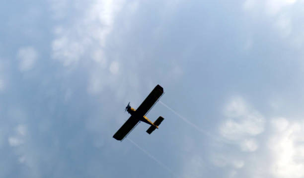 istock Airplane on the sky silhouette 1180667072