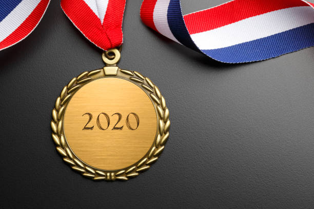 istock Gold Medal Engraved With 2020 On Black Background 1180667390