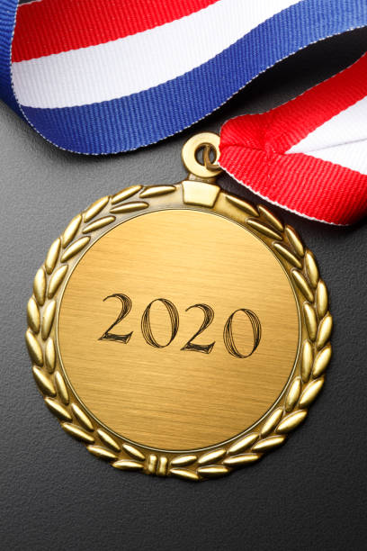 istock Gold Medal Engraved With 2020 On Black Background 1180667394