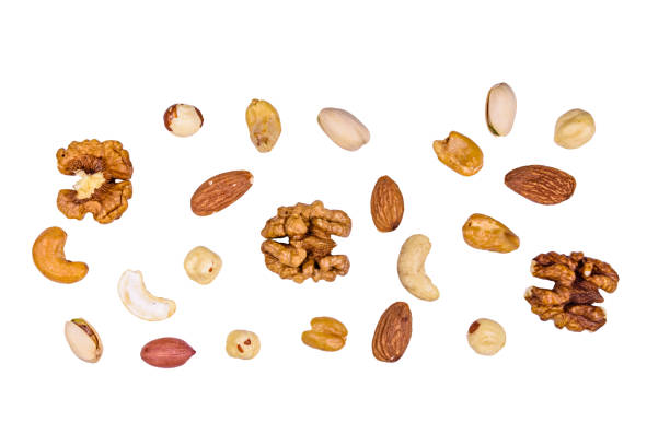 istock Various nuts (almond, cashew, hazelnut, pistachio, walnut) isolated on a white background. Vegetarian meal. Healthy eating concept 1180668354