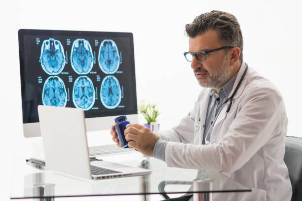 istock Doctor holding an unlabeled bottle of tablets 1180669752