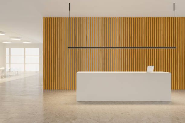 istock White and wooden office hall with reception 1180671424