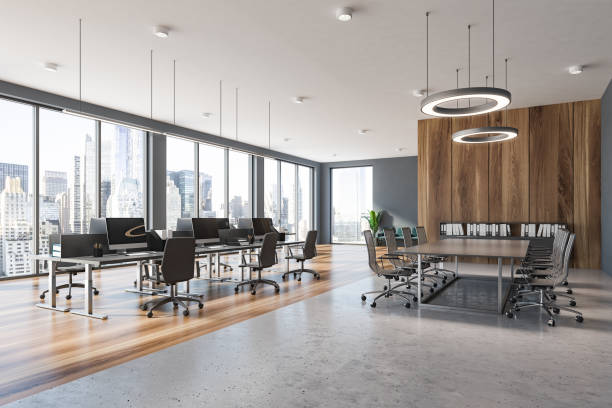 istock Gray and wooden panoramic office and meeting room 1180671461
