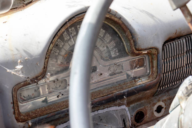 istock Steering wheel of an old abandoned rusty car with a speedometer close up 1180671671