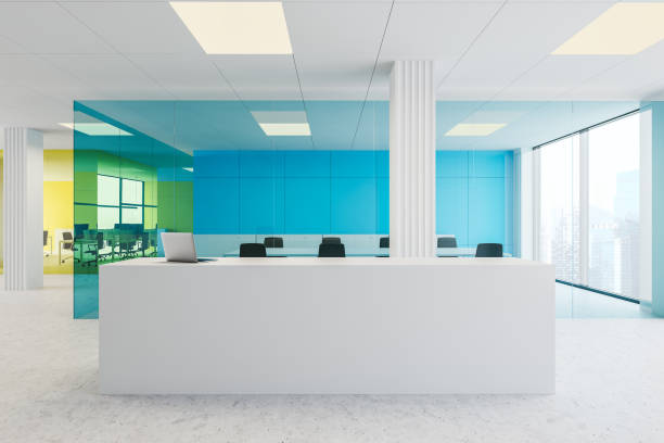 istock Reception desk in blue and yellow office 1180671680