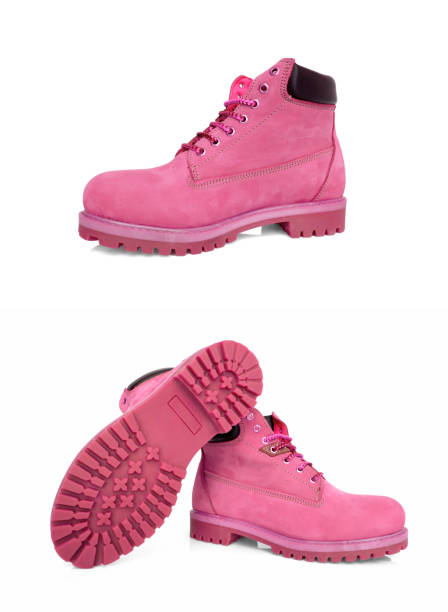 istock Female pink leather boots on white background, isolated product. 1180673036