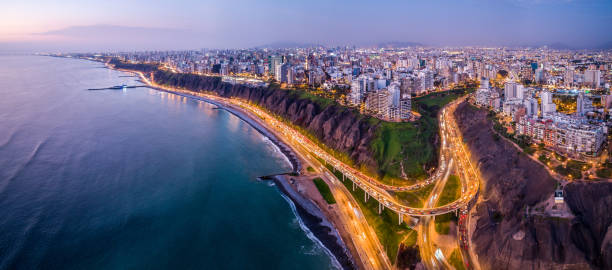 AERIAL VIEW OF MIRAFLORES, LIMA, PERU Aerial view of Lima city from Miraflores at blue time. lima peru photos stock pictures, royalty-free photos & images