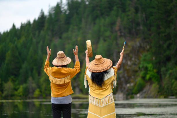 First Nations Women in Traditional Clothing Native American Women performing a welcome song. First Nations women singing. Traditional Canadian culture. british columbia photos stock pictures, royalty-free photos & images