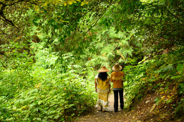 First Nations Canadian Women First Nations Canadians. Indigenous women walking in a forest. Canadian culture and history. Indian Trail stock pictures, royalty-free photos & images