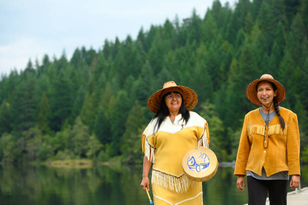First Nations Canadians. Indigenous women walking on a boardwalk. Canadian culture and history.