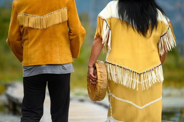 First Nations Canadians. Indigenous women walking in a forest. Canadian culture and history.