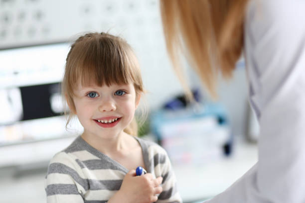 istock Smiling little patient having doctors appointment 1180686965
