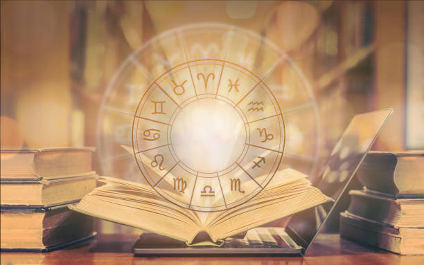 istock Zodiac sign horoscope astrology and constellation study for foretell and fortune telling education course concept with horoscopic wheel over old book and computer laptop in school library 1180687484