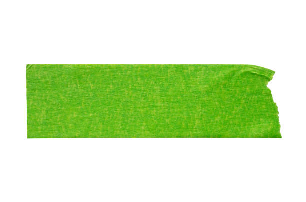 istock Green adhesive paper tape isolated on white background 1180687836