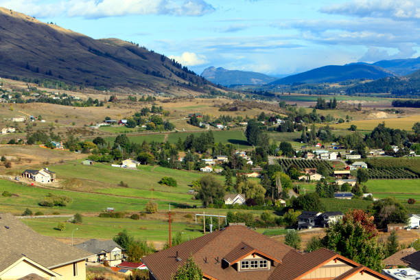 istock Overlooking Rooftops In The Coldstream Valley To Orchards And Mountains 1180695163