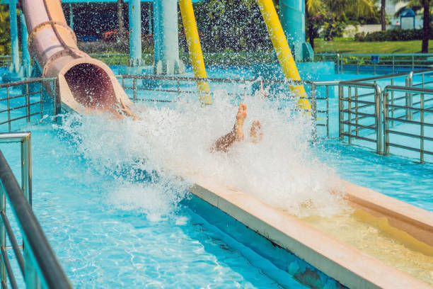 istock Man having fun at water park. 1180695504