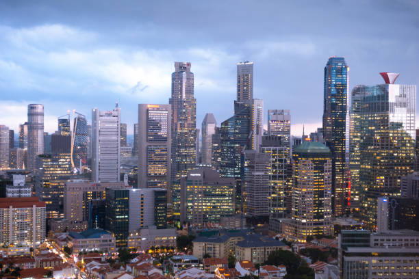 Skyscraper and skyline in Singapore city night. Cityscape and businedd building in night.
