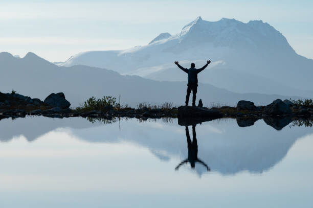 Hiking in the mountains Man hiking solo in the mountains. Vacationing in the great outdoors. Man living an active lifestyle. garibaldi park stock pictures, royalty-free photos & images