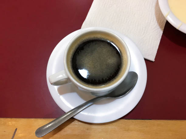 istock with cup with dark coffee in the evening 1180701710