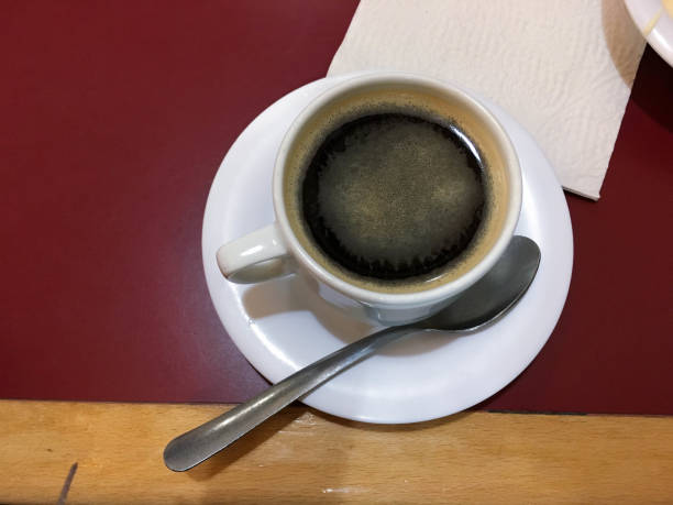 istock with cup with dark coffee in the evening 1180701734