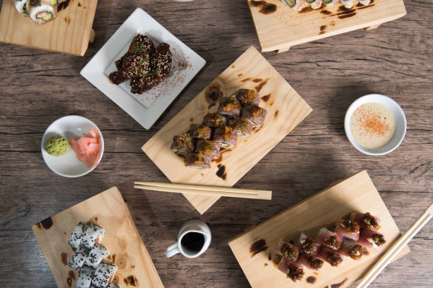 istock Japanese sushi set. Sashimi, maki rolls and green tea. 1180702625