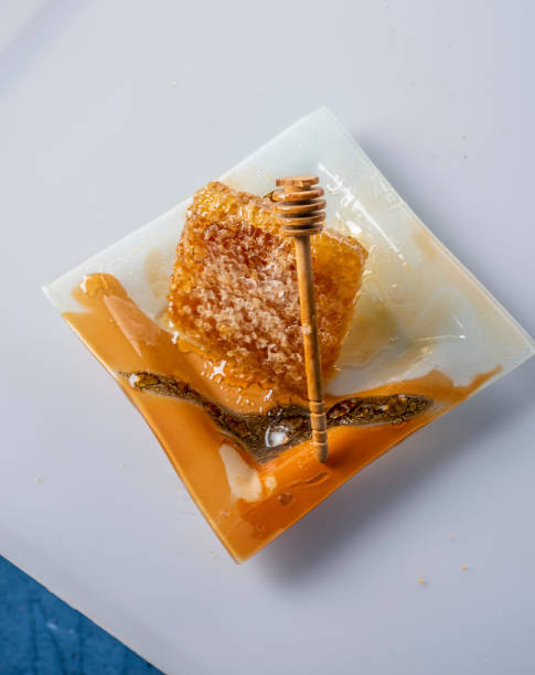 Raw honeycomb with dish and "spoon". Autumn harvest