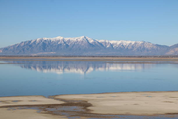 istock Snowcapped Wasatch mountains reflections on Great Salt Lake, Antelope Island, Utah 1180706726