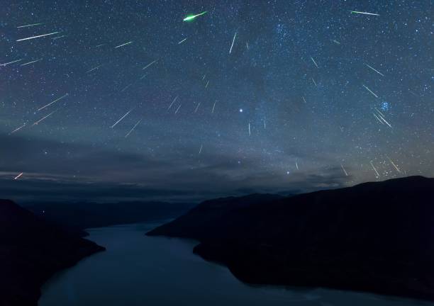 Meteor shower Perseids meteor shower, appeared during the middle of August every year. meteor shower stock pictures, royalty-free photos & images