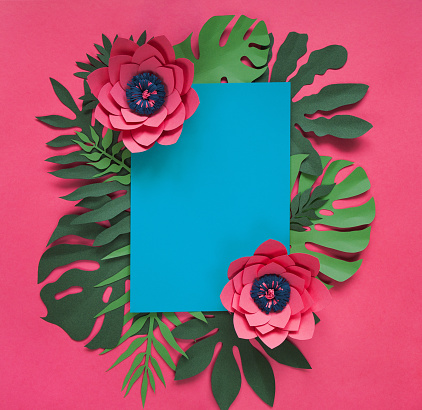 Handcraft Creative Decorative Floral Frame Made Of Paper Flowers And Leaves, Card For Invitation With Various Leaves On A Blue. Flat Lay.