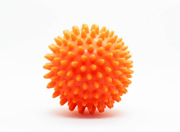 istock Red rubber spike ball for massage isolated on white background. 1180716445
