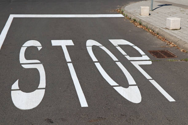 istock Stop sign in the road crossing 1180718879