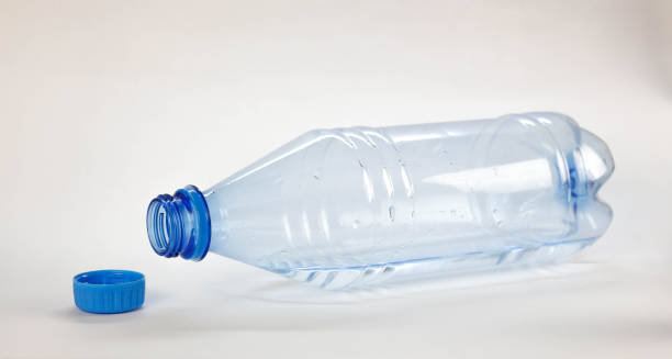 istock Blue bottle with drinking water. Close up. Isolated on white background 1180723326