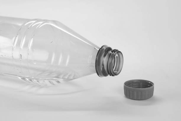 istock Gray bottle with drinking water. Close up. Isolated on white background 1180723328