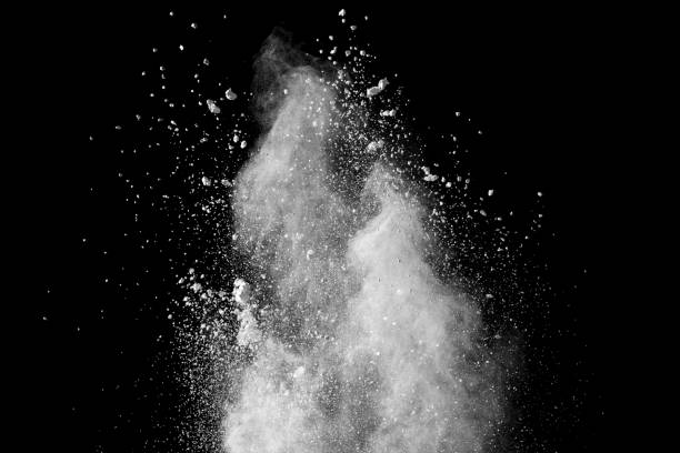 istock Bizarre forms of white powder explosion cloud against black background.White dust particles splash. 1180724343