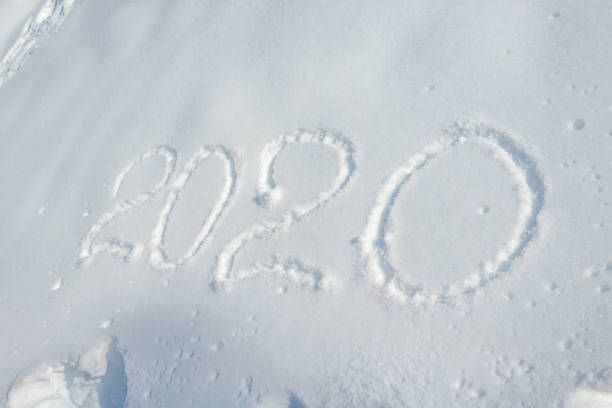 istock Handwritten inscription on snow 2020. Happy New Year 1180724363