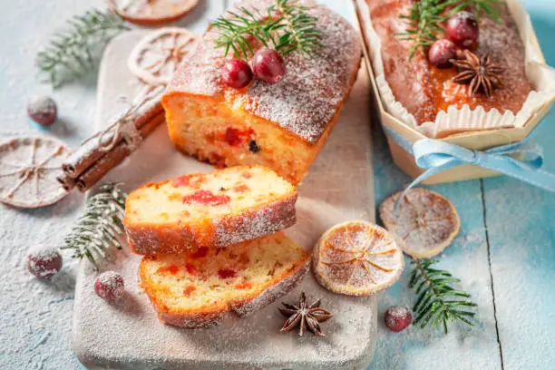 Traditionally Fruitcake for Christmas decorated with sugar powder